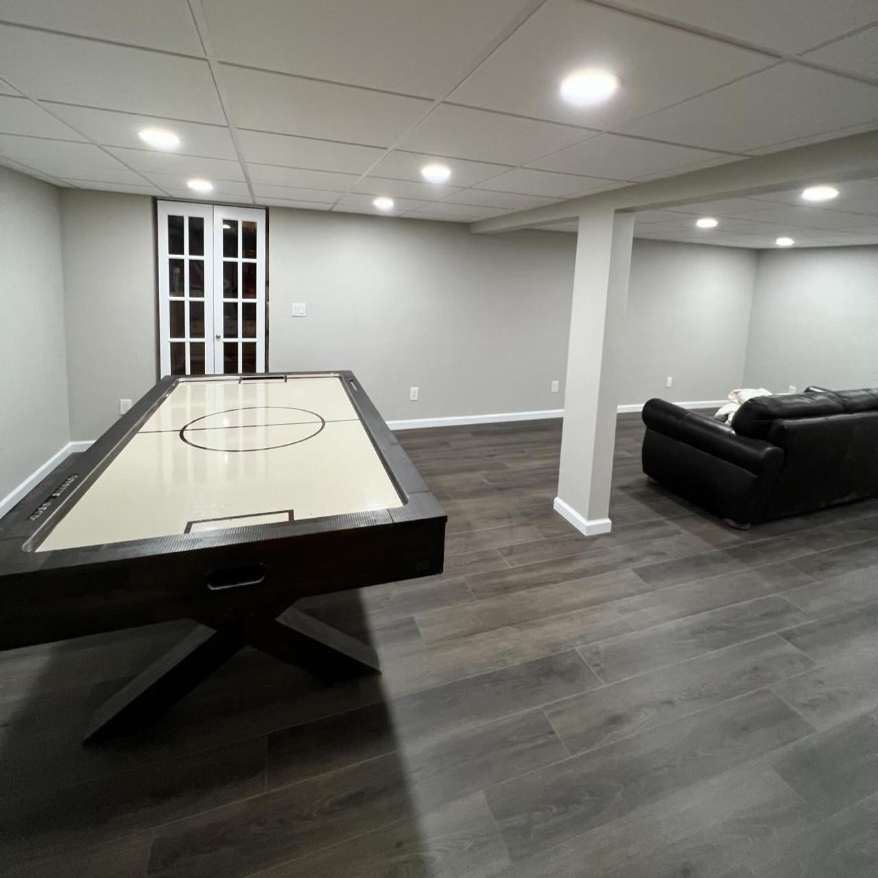 Bright basement with modern lighting